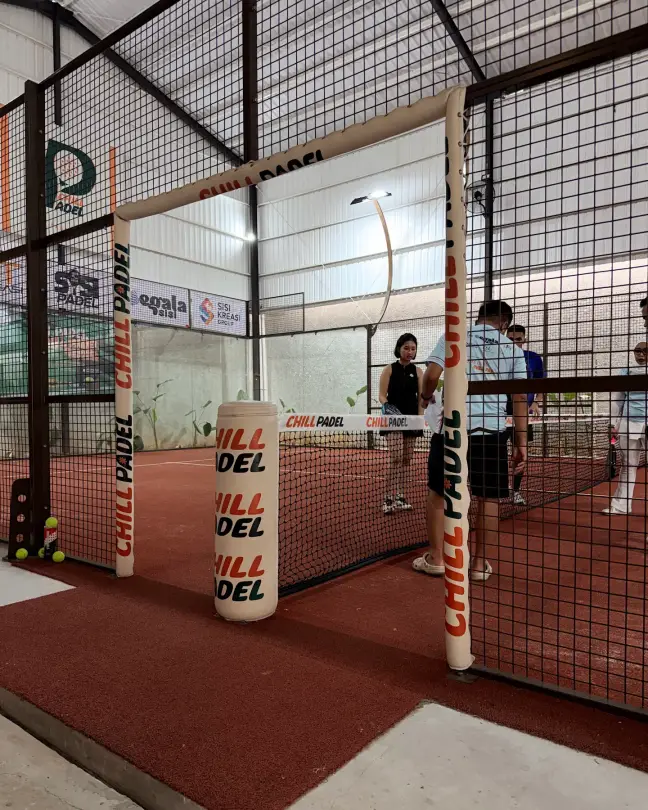 The Chill Padel net and posts on the terracotta court